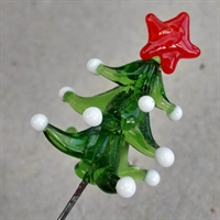 Glas nipsenål, et grønt juletræ med rød stjerne og hvide lys.